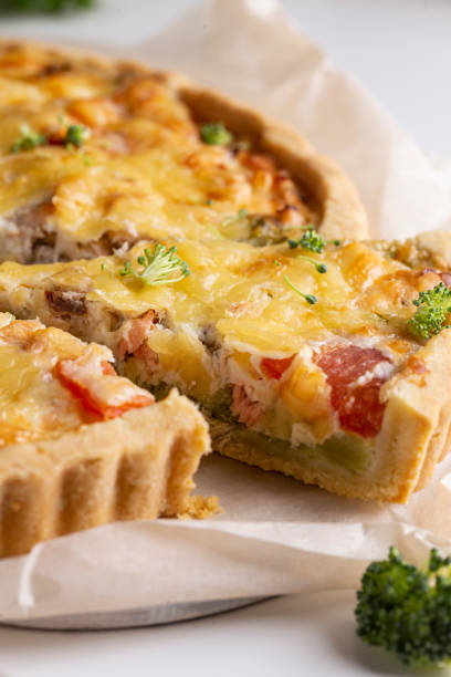 istock Dinner with fresh homemade pie with salmon fish and broccoli, quiche 1439669523