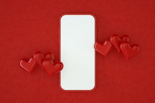 Valentine's Day Concept Online Shopping Blank Screen Smart Phone with Hearts. Red Background.