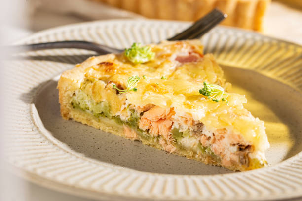 istock Dinner with fresh homemade pie with salmon fish and broccoli, quiche 1439669839