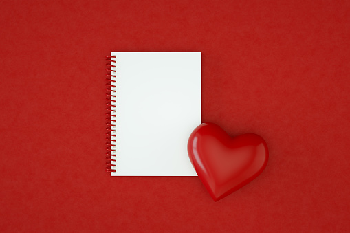 Valentine's Day Concept Blank Note Pad with Heart. Red Background.