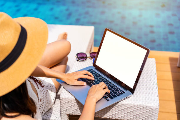 istock Young woman freelancer traveler working online using laptop while traveling on summer vacation, Freelance and workation concept 1439674325