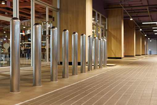 steel bollards in front  underground entrance of the building.