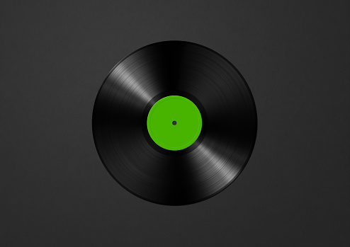 Green vinyl record isolated on black background. 3D illustration