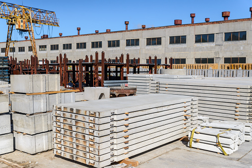New road slabs in the warehouse of the precast concrete plant, as well as other concrete products