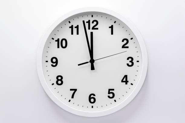 simple analog wall clock on white background. - clock imagens e fotografias de stock