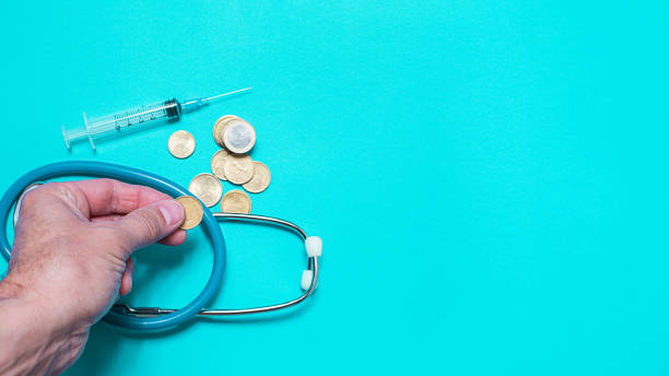 Syringe with vaccine on blue background from above