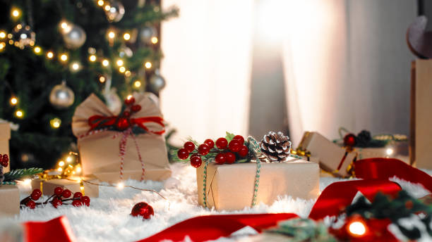 istock Christmas gif box on the white carpet against the tree 1439684674