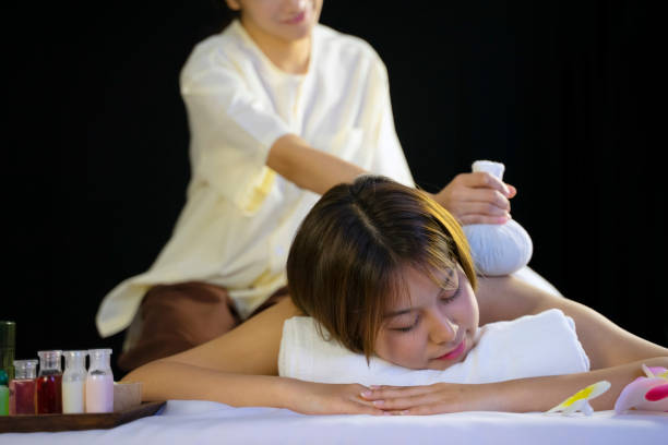 Customer and employee are at spa and resort. Leisure activity, relaxation and vacation concept.