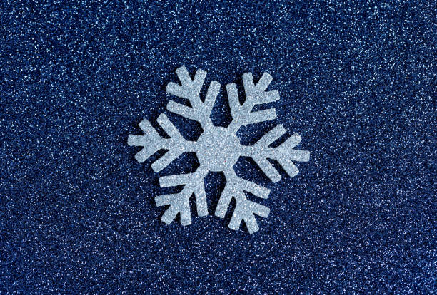 istock Large blue snowflakes on a blue background. Stylish Christmas concept. 1439686853