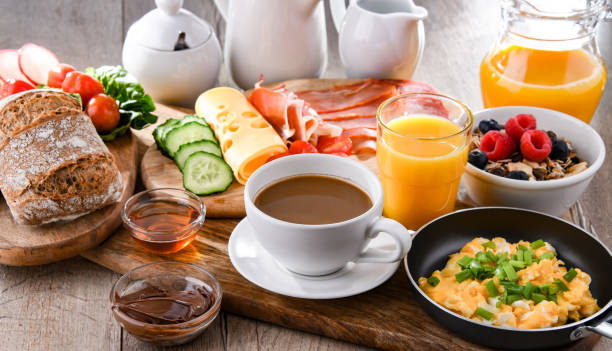 istock Breakfast served with coffee, scrambled eggs, cereals and ham 1439691660