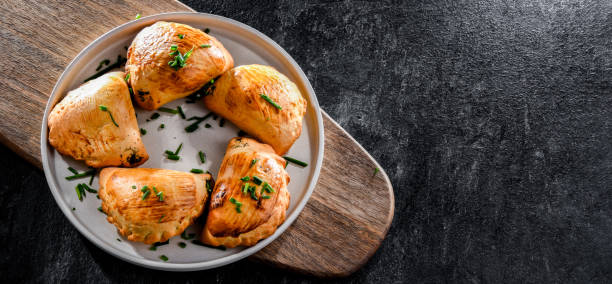 istock Composition with a plate of oven-baked pierogi 1439691683