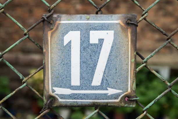 istock Weathered enameled plate number 17 1439695077
