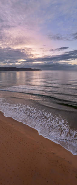 istock Aerial sunrise seascape with rain clouds 1439695385