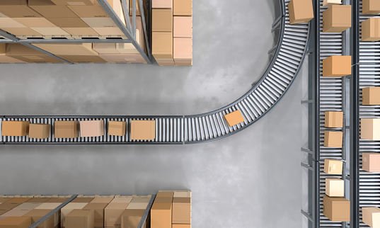 Top view of conveyor belts transporting boxes ready to be shipped in a large distribution warehouse full of merchandise . Organization and efficiency. Digitally generated image.