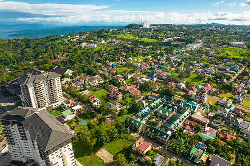 Tagaytay, Cavite, Philippines - May 2022: Aerial of luxury condominiums and upscale houses near the ridge.