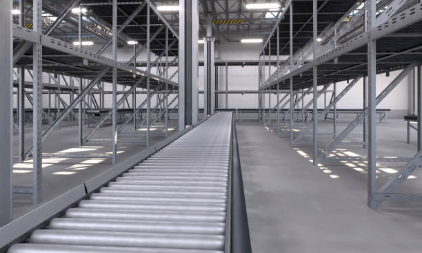 Empty conveyor belt point of view, empty shelves in large shipping warehouse stock photo