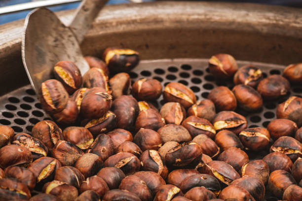istock Roasting chestnuts in a bowl or grill on an open fire 1439702016