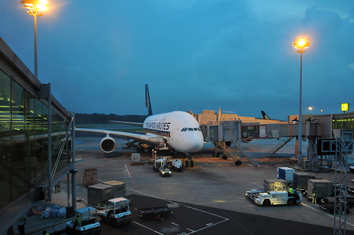 Singapore- August 4, 2011: Singapore is the financial center in Southeast Asia and the Changi Airport is one of the World's best airports. Here is an Airbus 380-800 airplane of Singapore Airlines in Changi Airport.