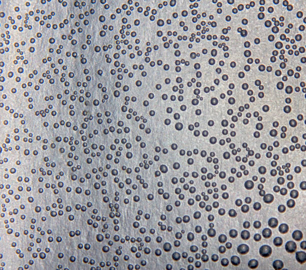 istock Harmonic backgrounds. Air bubbles in water (bleb) on bright, smooth surface 1439703148