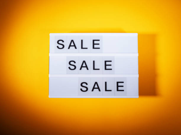 istock Sale store concept with lightbox text on orange background 1439703247