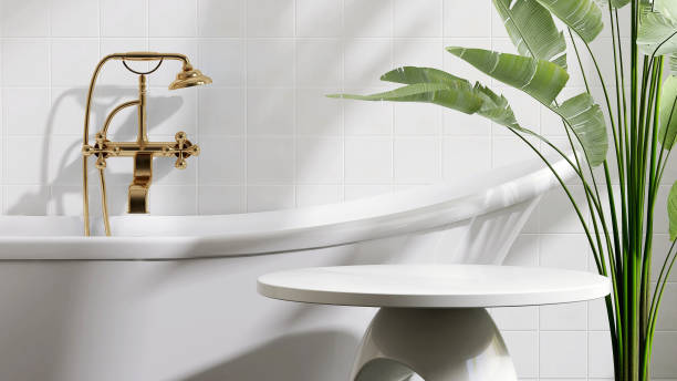 istock White round ceramic side table by bathtub in luxury design bathroom and tropical banana tree with dappled sunlight from window and leaf shadow on white tile wall 1439703420