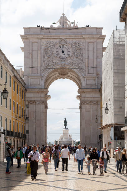Lisbon, Portugal - June 02 2018: The Rua Augusta Arch (Portuguese: Arco da Rua Augusta) is a stone, triumphal arch-like, historical building and visitor attraction on the Praça do Comércio.