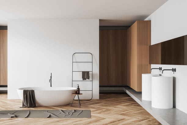 istock Light bathroom interior with bathtub and double sink. Mockup wall 1439706695