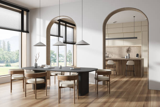 istock Stylish kitchen interior with dining and cooking zone, panoramic window 1439706956