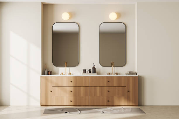 istock Beige bathroom interior with two washbasins and cabinet with accessories 1439707294