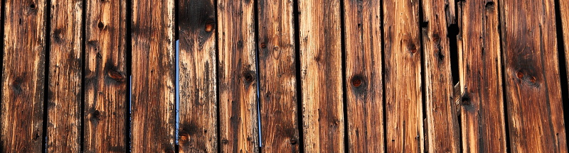 an old weathered wooden wall as an advertising background