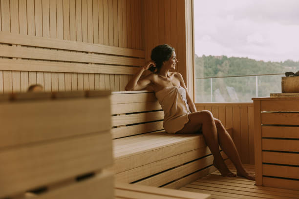 istock Young woman relaxing in the sauna 1439711341