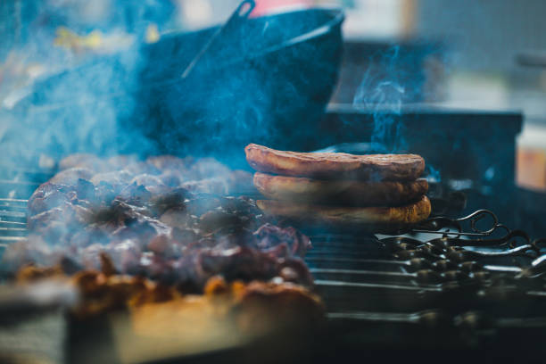 istock Meat, vegetables and bread rolls baked on coals. 1439711921
