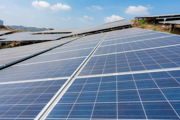 istock Close-up of solar panels under blue sky and white clouds 1439712658