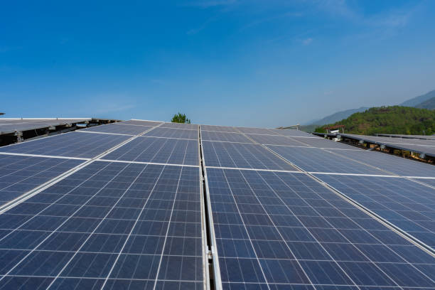 istock Close-up of solar panels under blue sky and white clouds 1439712737