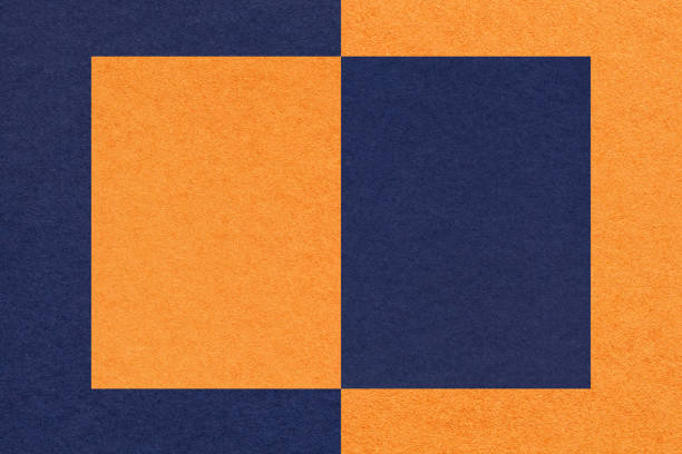istock Texture of navy blue and orange paper background with geometric shape and pattern, macro. 1439714082