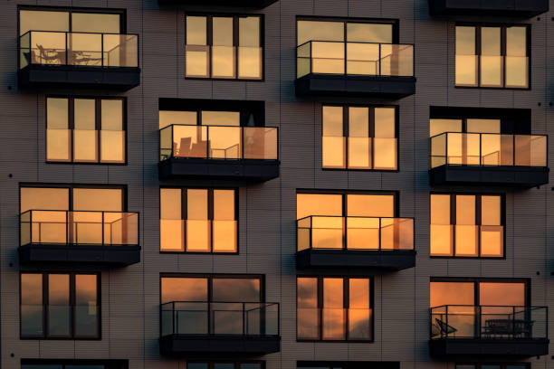 istock Modern glass facade with balconies in the evening sun 1439718408