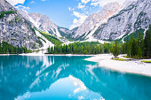 The beautiful landscape of Lake Braies with turquoise water and high Dolomites mountains.
