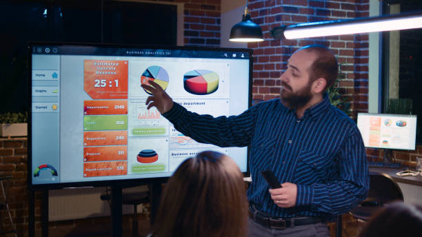 istock Business analytics team meeting, project manager showing corporate presentation 1439720823