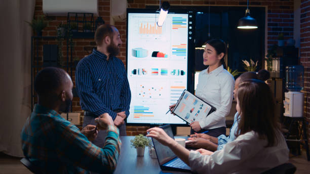 istock Diverse coworkers presenting company annual statistics report 1439721617
