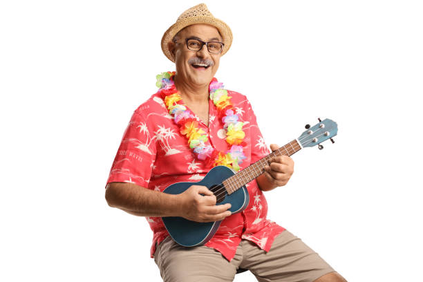 istock Marture man with flower chain around neck playing ukulele and smiling 1439721718