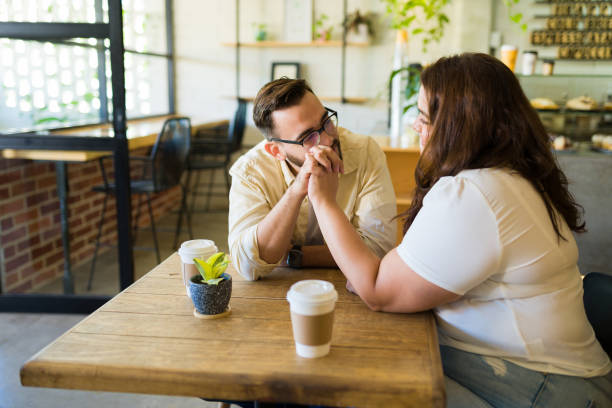 istock Romantic couple drinking coffee on a date 1439721867