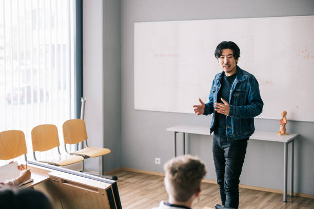 istock Professor teaching group of people 1439722463