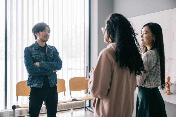 istock Group of students having a chat after lecture 1439722523