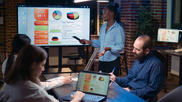 istock Business coach company analytics presentation, corporate team meeting 1439722764
