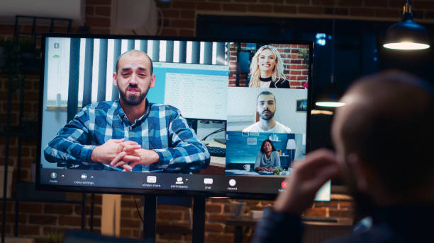 istock Employees talking with team in teleconference, screen close up 1439723051