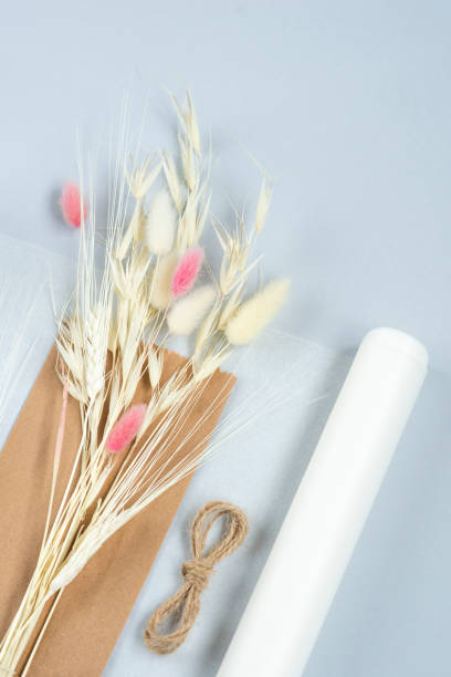 istock Basic set for simple home-made beautiful pink bouquet of dried flowers at the master class. Idea for a hobby, business. Making trendy eco diy of long standing flowers on light background 1439723245