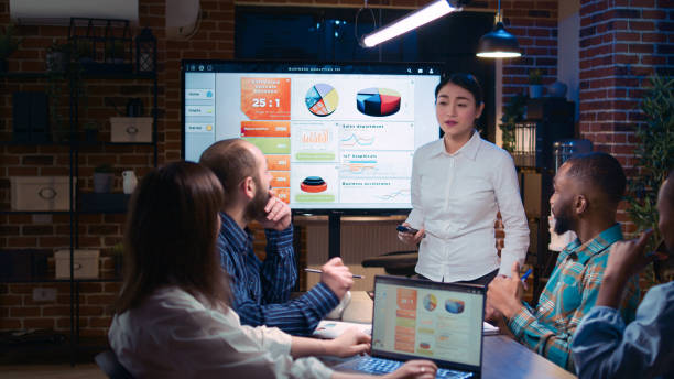 istock Team working on company revenue statistics presentation in meeting 1439723381
