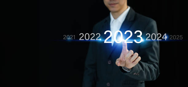 istock Businessman finger pressing and pointing on year 2023 on virtual screen on dark background with copy space. Business planning, goals and achievement in 2023. Happy new year concept 1439726775