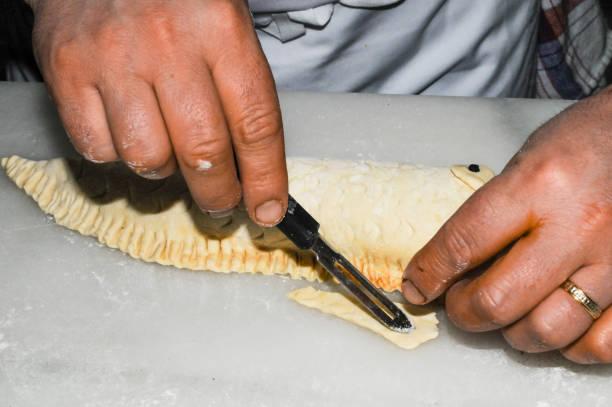 istock Preparing the puff pastry of a stuffed whiting. 1439730774
