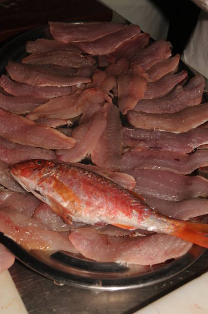 istock Raw, fresh, clean and open red mullet in a restaurant kitchen 1439731012